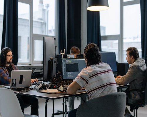Team of AI engineers working on code